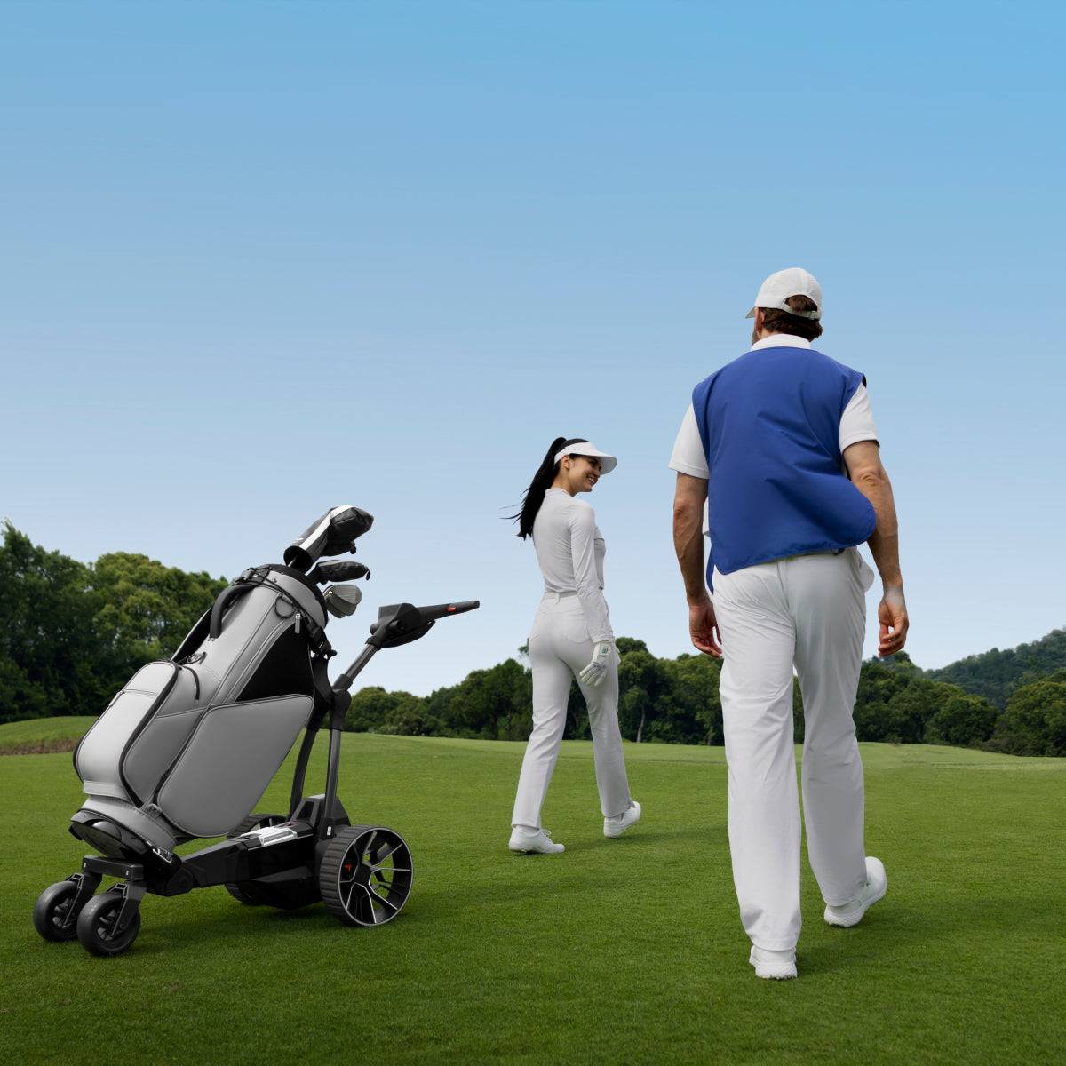 Birdie 3X following two golfers hands free on the course